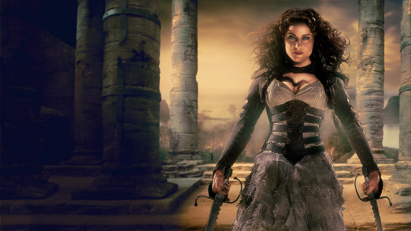 Illustration for article titled In Seventh Son, Julianne Moore's Shoulderpads Have Magic Dragon Powers